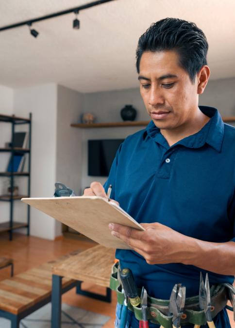 repair man holding clipboard